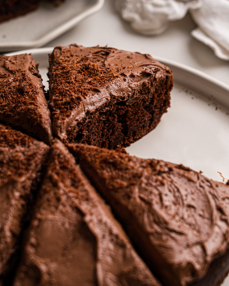 Close-up picture of a piece of chocolate cake with no refined sugar—rich, moist, and perfect for clean eating dessert lovers