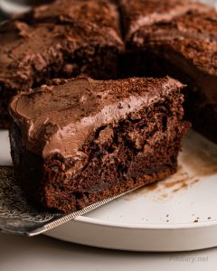 Close-up of a single slice of healthy chocolate cake with no refined sugar—rich, moist, and perfect for clean eating dessert lovers