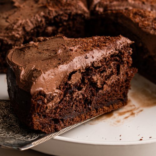 Close-up of a single slice of healthy chocolate cake with no refined sugar—rich, moist, and perfect for clean eating dessert lovers