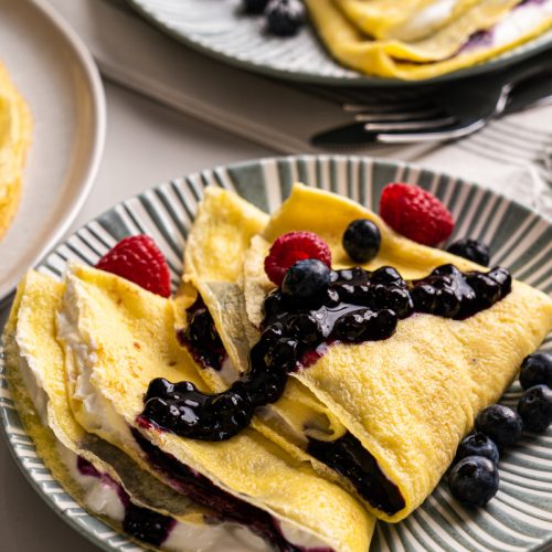 High protein crepes with Greek yogurt, blueberry sauce and berries