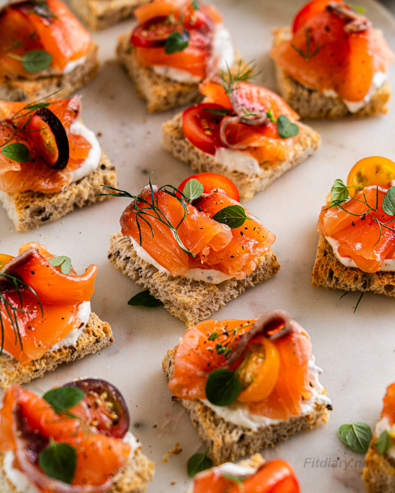 Cured salmon bites on mini canapés perfect for a healthy party appetizer