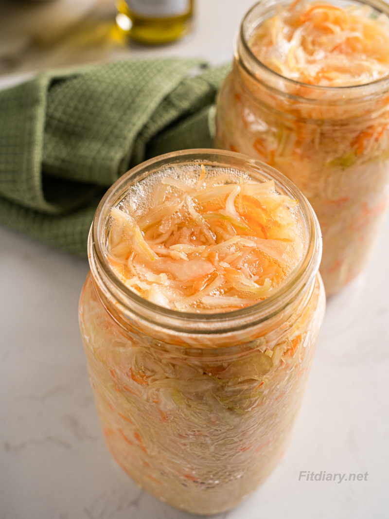 Glass jars filled with homemade sauerkraut
