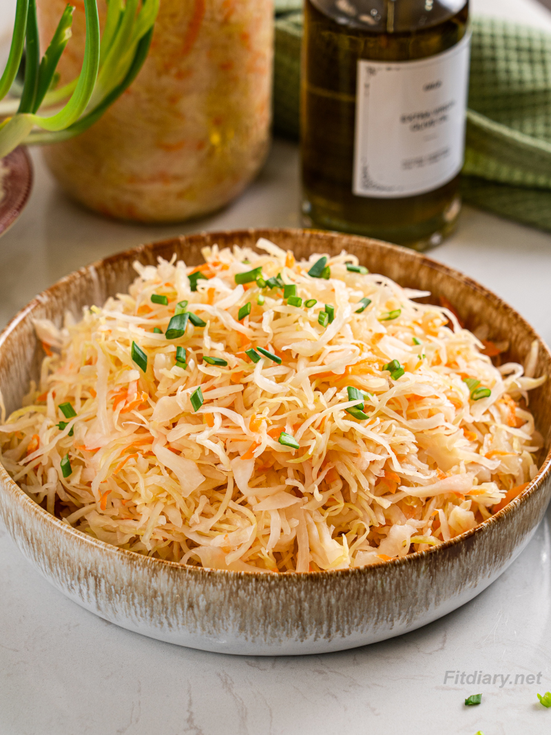 Homemade sauerkraut in a bowl showing a crunchy, naturally fermented cabbage texture