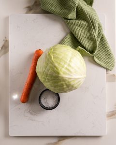 Cabbage, carror and salt for homemade sauerkraut fermentation. Sauerkraut recipe.